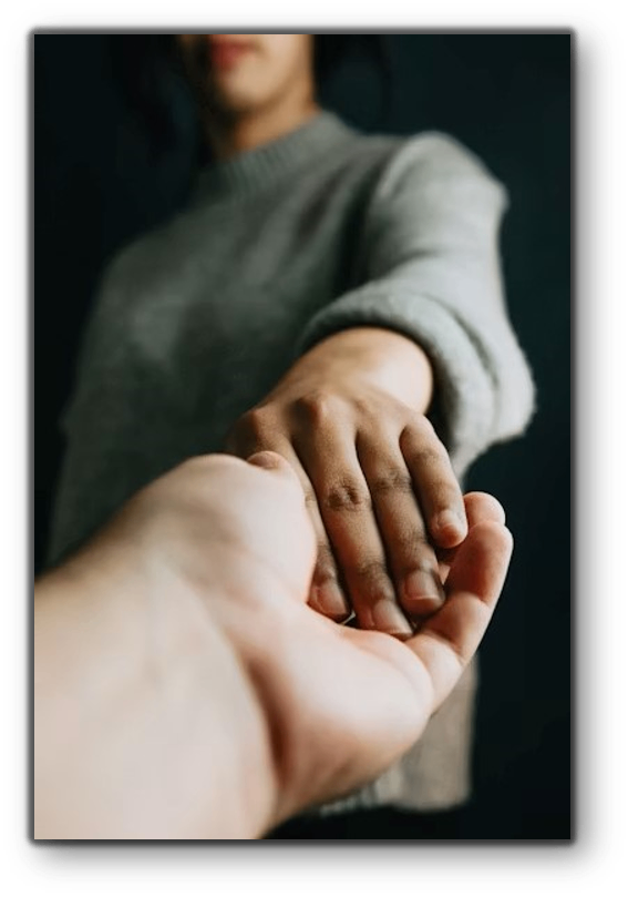 Hands reaching together — Living A.M.E.N.D.S community